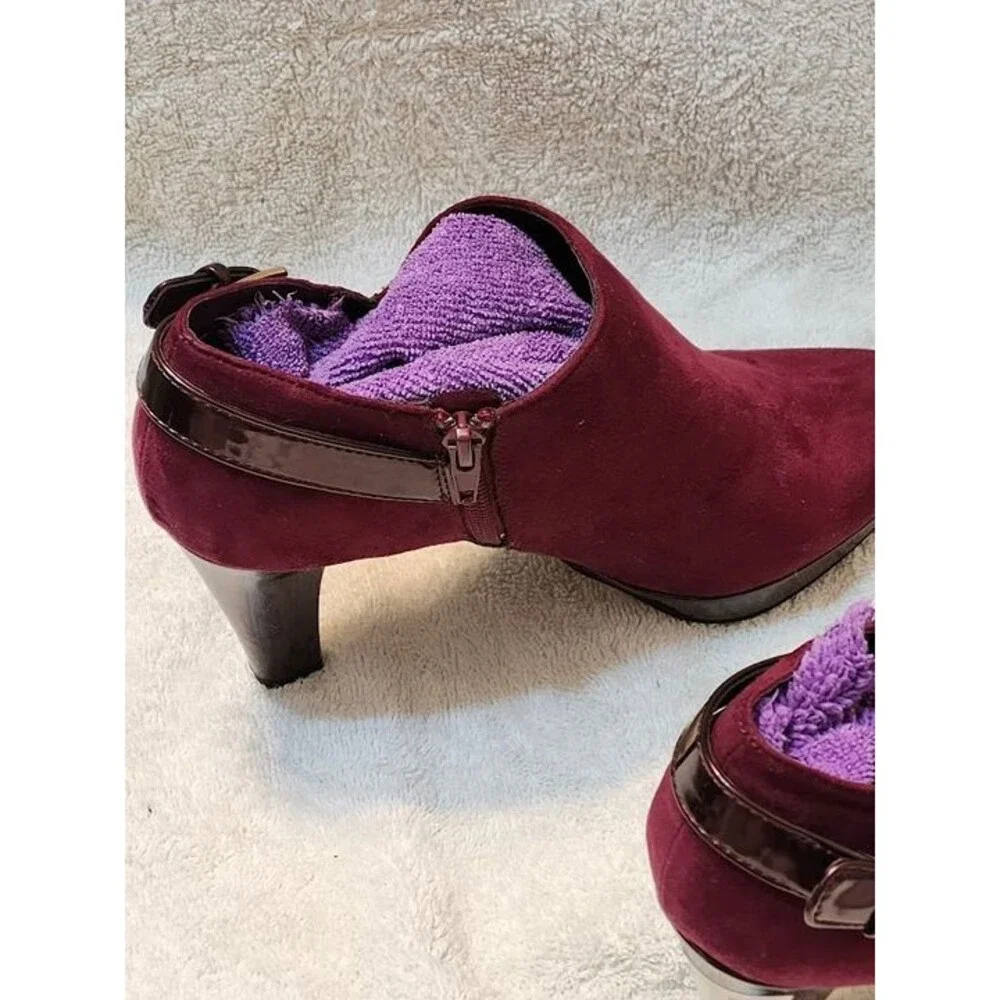Women’s East 5th faux suede ankle booties in a rich maroon color with glossy pat